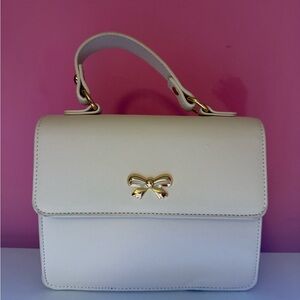 Elegant Cream Handbag with Gold Accents